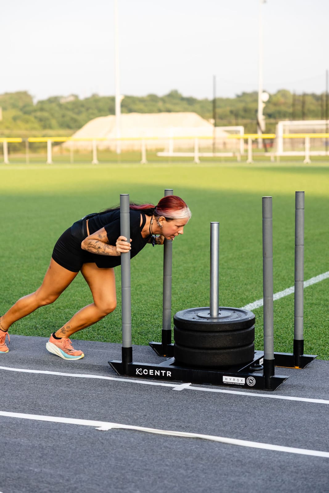 An athlete driving the sled low and hard