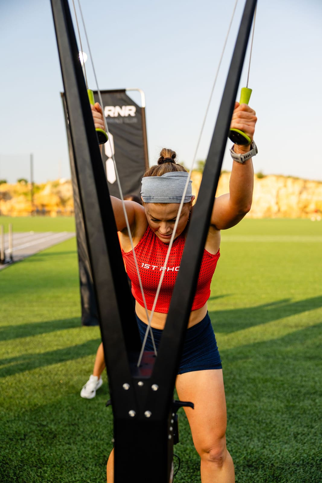 An athlete pulling the rope, head down